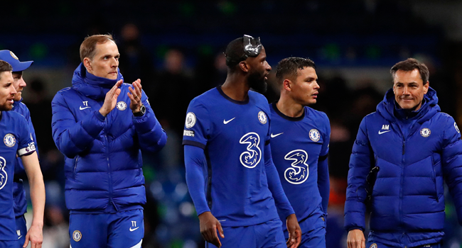 Chelsea's German head coach Thomas Tuchel (L) applauds the fans following during the English Premier League football match between Chelsea and Leicester City at Stamford Bridge in London on May 18, 2021. Chelsea won the match 2-1. PETER CZIBORRA / POOL / AFP