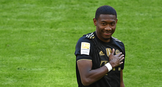 In this file photo taken on May 22, 2021 Bayern Munich's Austrian defender David Alaba gestures prior the German first division Bundesliga football match Bayern Munich vs FC Augsburg in Munich, southern Germany. CHRISTOF STACHE / POOL / AFP