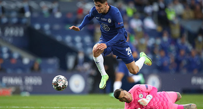 helsea's German midfielder Kai Havertz (L) scores a goal past Manchester City's Brazilian goalkeeper Ederson during the UEFA Champions League final football match between Manchester City and Chelsea FC at the Dragao stadium in Porto on May 29, 2021. Jose Coelho / POOL / AFP