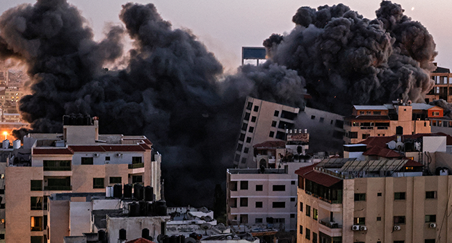 Smoke billows from an Israeli air strike on the Hanadi compound in Gaza City, controlled by the Palestinian Hamas movement, on May 11, 2021. MAHMUD HAMS / AFP