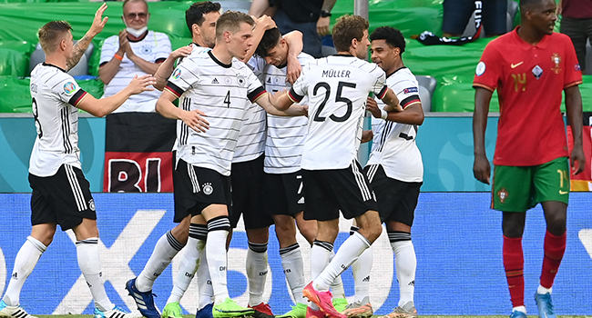 Germany's players celebrate scoring their team's third goal during the UEFA EURO 2020 Group F football match between Portugal and Germany at Allianz Arena in Munich, Germany, on June 19, 2021. CHRISTOF STACHE / POOL / AFP
