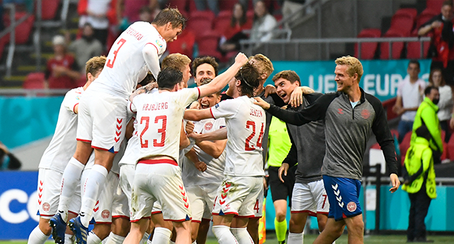 Denmark's players celebrate after winning the UEFA EURO 2020 round of 16 football match between Wales and Denmark at the Johan Cruyff Arena in Amsterdam on June 26, 2021. Piroschka van de Wouw / POOL / AFP