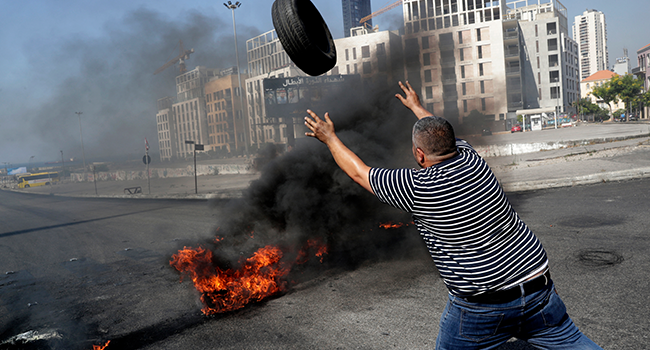 Demonstrators burn tires to block the Martyrs' Square in the centre of Lebanon's capital Beirut on June 26, 2021, as they protest against dire living conditions amidst the ongoing economical and political crisis. ANWAR AMRO / AFP