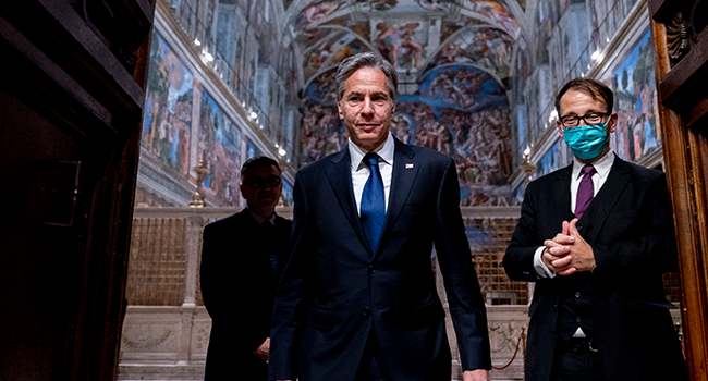 US Secretary of State Antony Blinken (C) and Charge d'Affaires of the US Embassy to the Holy See Patrick Connell (L) and tour guide Alessandro Conforti (R), leave the Sistine Chapel, in the Apostolic Palace, at the Vatican, ahead of a meeting with Pope Francis and Archbishop Paul Gallagher, as part of a three-nation tour of Europe, on June 28, 2021. Andrew Harnik / POOL / AFP