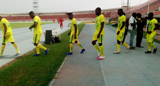 Kano Pillars Players filling out for a league match.