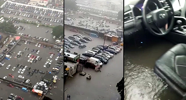 Several vehicles... submerged under water in parks at the popular Marina axis of Lagos Island...