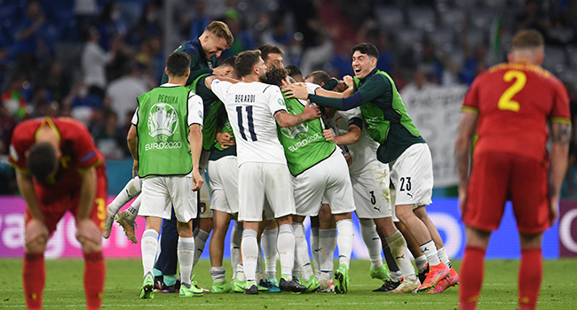 Italy players celebrate victory as Belgium players react at the end of the UEFA EURO 2020 quarter-final football match between Belgium and Italy at the Allianz Arena in Munich on July 2, 2021. ANDREAS GEBERT / POOL / AFP