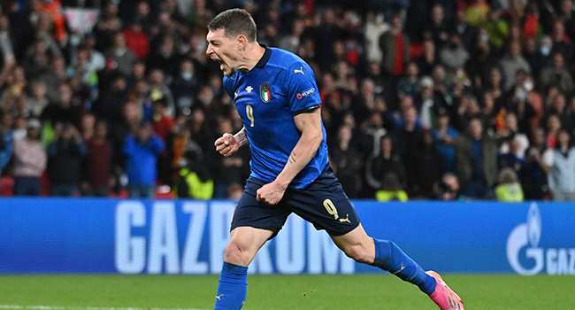 Italy's forward Andrea Belotti shoots and scores in a penalty shootout during the UEFA EURO 2020 semi-final football match between Italy and Spain at Wembley Stadium in London on July 6, 2021. JUSTIN TALLIS / POOL / AFP