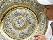Australia's Ashleigh Barty kisses the winner's Venus Rosewater Dish trophy after winning her women's singles match against Czech Republic's Karolina Pliskova on the twelfth day of the 2021 Wimbledon Championships at The All England Tennis Club in Wimbledon, southwest London, on July 10, 2021. Glyn KIRK / AFP