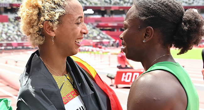 First-plcaed Germany's Malaika Mihambo (L) celebrates with third-placed Nigeria's Ese Brume after competing in the women's long jump final during the Tokyo 2020 Olympic Games at the Olympic Stadium in Tokyo on August 3, 2021. Andrej ISAKOVIC / AFP