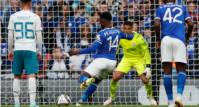 Leicester City's Nigerian striker Kelechi Iheanacho (C) scores the opening goal from the penalty spot during the English FA Community Shield football match between Manchester City and Leicester City at Wembley Stadium in north London on August 7, 2021. Adrian DENNIS / AFP