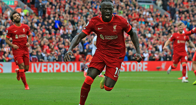 Liverpool's Senegalese striker Sadio Mane celebrates after he scores his team's second goal during the English Premier League football match between Liverpool and Burnley at Anfield in Liverpool, north west England on August 21, 2021. Lindsey Parnaby / AFP