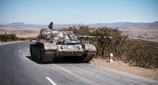 In this file photo taken on February 26, 2021 A damaged tank stands on a road north of Mekele, the capital of Tigray. EDUARDO SOTERAS / AFP