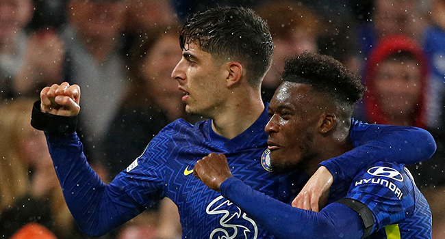 Chelsea's German midfielder Kai Havertz (l) celebrates scoring his team's third goal WITH Chelsea's English midfielder Callum Hudson-Odoi during the Champions League group H football match between Chelsea and Malmo FF at Stamford Bridge in London on October 20, 2021. Adrian DENNIS / AFP