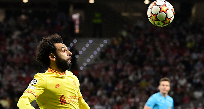 Liverpool's Egyptian forward Mohamed Salah eyes the ball during the UEFA Champions League Group B football match between Atletico Madrid and Liverpool at the Wanda Metropolitano stadium in Madrid on October 19, 2021. JAVIER SORIANO / AFP