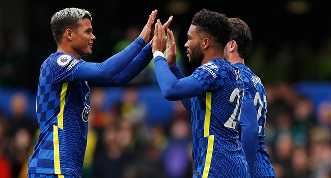 Chelsea's English defender Reece James (R) celebrates scoring his team's third goal during the English Premier League football match between Chelsea and Norwich City at Stamford Bridge in London on October 23, 2021. Adrian DENNIS / AFP