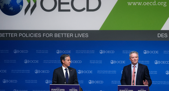 Secretary-General of the Organization for Economic Cooperation and Development (OECD) Mathias Cormann (R) and US Secretary of State Anthony Blinken hold a closing press conference at the 60th OECD Ministerial Council Meeting on October 6, 2021, in Paris. Ian LANGSDON / POOL / AFP