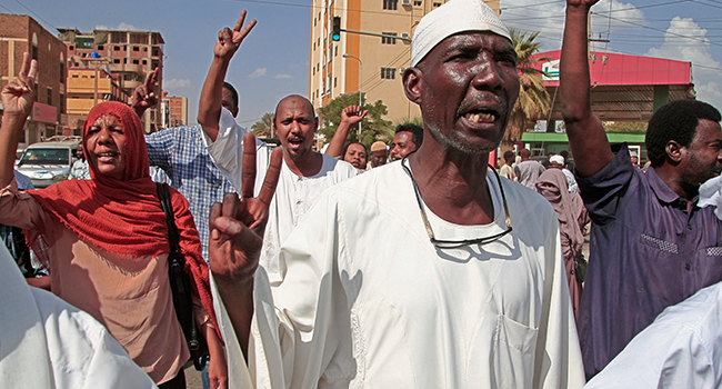 Supporters of the Umma Party, Sudan's largest political party, chant slogans during a protest against a military coup that overthrew the transition to civilian rule, on October 29, 2021 in the capital Khartoum's twin city of Omdurman. Ebrahim HAMID / AFP