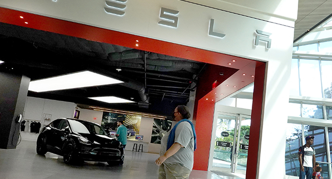 A Tesla Model Y electric vehicle is displayed on a showroom floor at the Miami Design District on October 21, 2021 in Miami, Florida. Joe Raedle/Getty Images/AFP