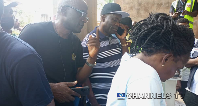 APGA Candidate, Charles Soludo, makes a call as he waits to vote in the Anambra governorship election on November 6, 2021.