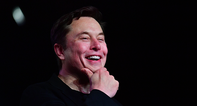 In this file photo taken on March 14, 2019 Tesla CEO Elon Musk reacts during the unveiling of the new Tesla Model Y in Hawthorne, California. Frederic J. BROWN / AFP