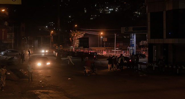 Residents scramble for safety as shots ring in Bukavu on November 7, 2021. GUERCHOM NDEBO / AFP