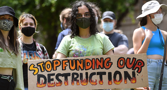 People participate in a rally during a global day of action on climate change in Melbourne on November 6, 2021, as world leaders attend the COP26 UN Climate Change Conference in Glasgow. William WEST / AFP