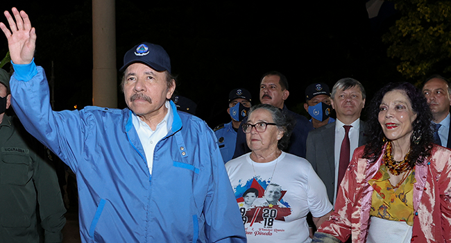 Handout picture released by the Nicaraguan presidency showing Nicaragua's President Daniel Ortega (L) waving at supporters during the commemoration of the 45th anniversary of the death of one of the founders of the Sandinista National Liberation Front (FSLN) guerrilla, Carlos Fonseca. Cesar PEREZ / Nicaraguan Presidency / AFP