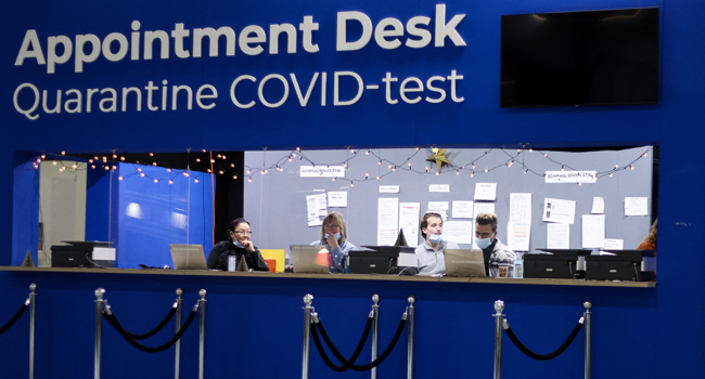 A picture taken on November 29, 2021 at the Schiphol airport shows an appointment desk for Covid-19 test. Kenzo TRIBOUILLARD / AFP