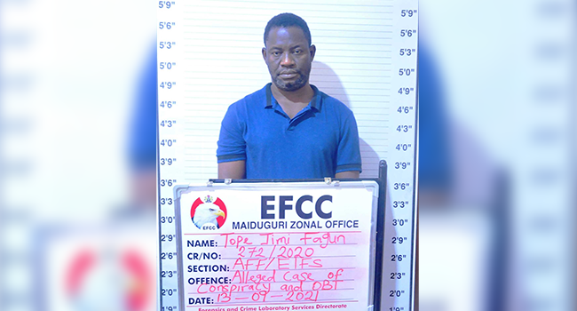 This photo shows Mr Tope Fagun in custody of the EFCC.