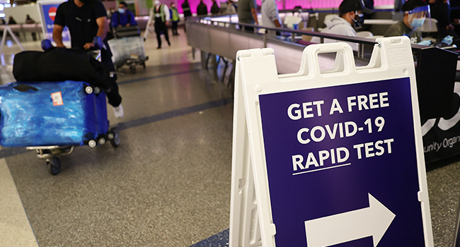 An international passenger arrives near a new rapid COVID-19 testing site for arriving international passengers at Los Angeles International Airport (LAX) on December 3, 2021 in Los Angeles, California. Mario Tama/Getty Images/AFP