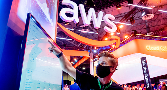  An attendee demonstrates software during AWS re:Invent 2021, a conference hosted by Amazon Web Services, at The Venetian Las Vegas on November 30, 2021 in Las Vegas, Nevada. Noah Berger/Getty Images for Amazon Web Services/AFP
