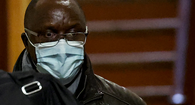 In this file photo taken on November 22, 2021 Franco-Rwandan former hotel driver Claude Muhayimana arrives at the Paris courthouse for his trial, in which he is accused of complicity in Rwanda's 1994 genocide by transporting Hutu militiamen who massacred hundreds of Tutsis. Thomas COEX / AFP