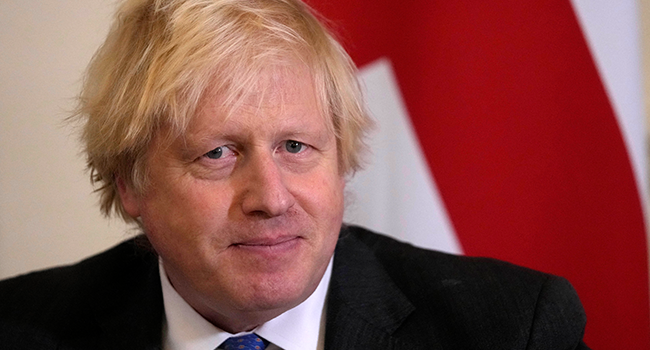 Britain's Prime Minister Boris Johnson looks on as he welcomes Oman's Sultan Haitham bin Tariq for talks in 10 Downing Street in London on December 16, 2021. Frank Augstein / POOL / AFP
