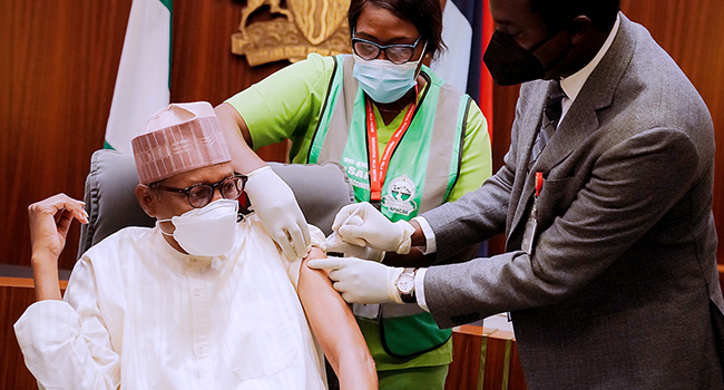 President Buhari receives his Covid-19 Booster Dose at the State House in Abuja on December 21, 2021. Bayo Omoboriowo/State House