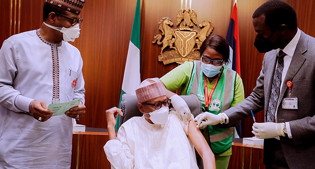 President Buhari receives his Covid-19 Booster Dose at the State House in Abuja on December 21, 2021. Bayo Omoboriowo/State House