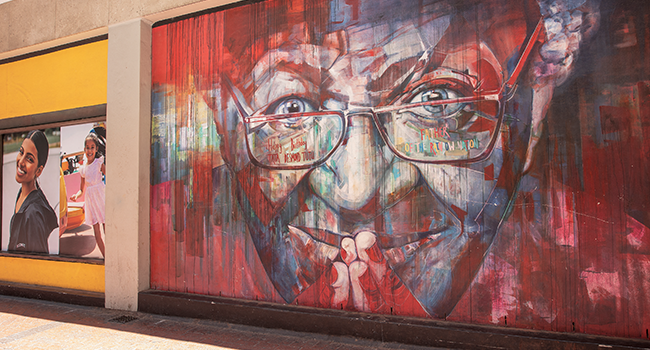 A graffiti art depicting the late South African Nobel Peace Price Archbishop Desmond Tutu is seen on a wall in a street in Cape Town CBD on December 26, 2021. GIANLUIGI GUERCIA / AFP