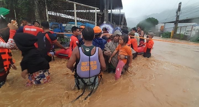 Thousands of Philippines evacuated from their homes next to a swollen river in Cagayan de Oro city on southern Mindanao island,