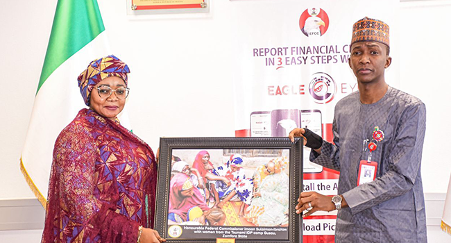 Chairman of the EFCC, Abdulrasheed Bawa and the Federal Commissioner, National Commission for Refugees, Migrants and Internally Displaced Persons, Imaan Suleiman Ibrahim stand together in Abuja on January 13, 2022.