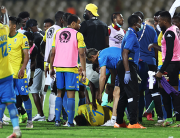 Gabon's forward Aaron Boupendza (down) lies on the ground after being punched by Ghana's forward Benjamin Tetteh (unseen) in a scuffle at the end of the during the Group C Africa Cup of Nations (CAN) 2021 football match between Gabon and Ghana at Stade Ahmadou Ahidjo in Yaounde on January 14, 2022. Kenzo Tribouillard / AFP