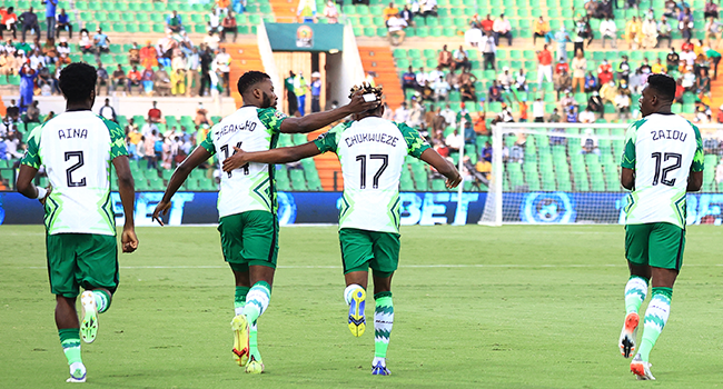 Nigeria's forward Samuel Chukwueze (C) celebrates with teammates after scoring the opening goal during the Group D Africa Cup of Nations (CAN) 2021 football match between Nigeria and Sudan at Stade Roumde Adjia in Garoua on January 15, 2022. Daniel BELOUMOU OLOMO / AFP