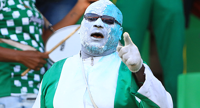 A Nigeria supporter cheers prior to the Group D Africa Cup of Nations (CAN) 2021 football match between Nigeria and Sudan at Stade Roumde Adjia in Garoua on January 15, 2022. Daniel BELOUMOU OLOMO / AFP