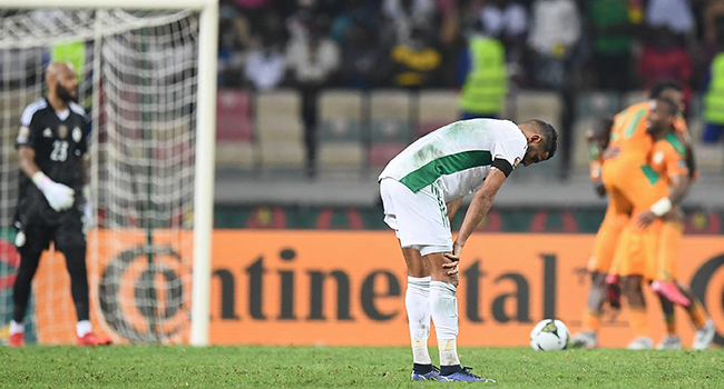 Algeria's forward Riyad Mahrez reacts after Ivory Coast scored their fourth goal that did not count during the Group E Africa Cup of Nations (CAN) 2021 football match between Ivory Coast and Algeria at Stade de Japoma in Douala on January 20, 2022. CHARLY TRIBALLEAU / AFP