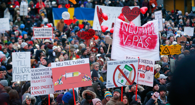 Anti-vaccine protesters take part in a demonstration under the motto "For a free Sweden without vaccine pass" in Stockholm, on January 22, 2022. Fredrik PERSSON / TT NEWS AGENCY / AFP