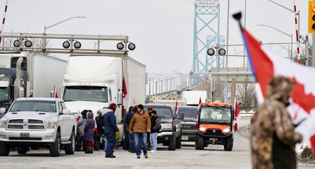 Canada Truckers Defy Order To Clear Key Bridge As Protests Swell