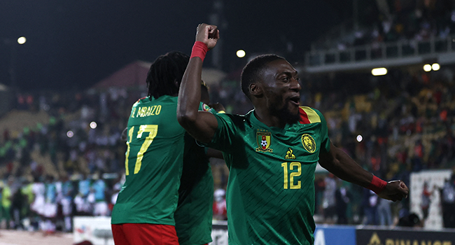 Cameroon's forward Karl Toko Ekambi celebrates their victory after the penalty shoot-out at the end of the Africa Cup of Nations (CAN) 2021 third place football match between Burkina Faso and Cameroon at Stade Ahmadou-Ahidjo in Yaounde on February 5, 2022. Kenzo TRIBOUILLARD / AFP