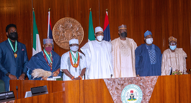 L-R; 2020 Award Winner Late Prof Charles Ejike Chidume, who was represented by his son, Dr Okechukwu Chidume, 2022 Award Winner, Prof Oluyinka Olutoye who was represented by his father, Oba Olufemi Olutoye, Award winner of 2021 Nigerian National Order of Merit, Prof Godwin Ekhaguere, President Muhammadu Buhari, SGF Mr. Boss Mustapha, Minister of Special Duties, Sen George Akume and Chairman, Nigerian National Merit Award Award (NNOM), Prof Shekarau Yakubu Aku during the presentation at the Presidential Villa in Abuja on February 8, 2022. Sunday Aghaeze/State House
