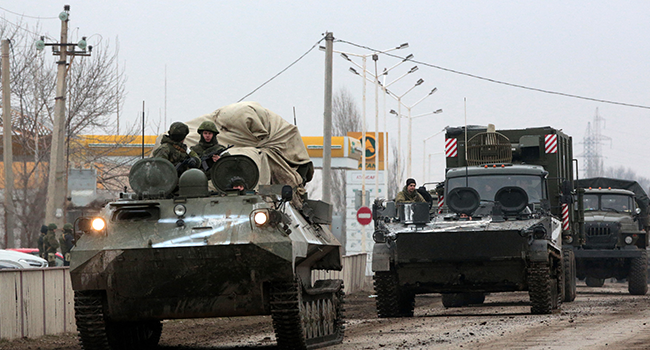 Russian army military vehicles are seen in Armyansk, Crimea, on February 25, 2022. STRINGER / AFP