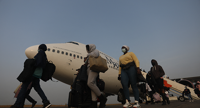 Nigerian students, who just got evacuated from Ukraine amidst the ongoing war between Russia and Ukraine, disembark from a chartered plane after landing at the Nnamdi Azikwe Airport Abuja, Nigeria on March 4, 2022. Kola SULAIMON / AFP