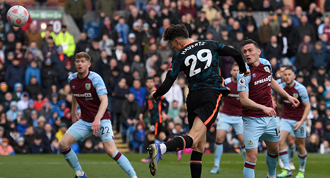 Chelsea's German midfielder Kai Havertz (C) heads the ball and scores the second goal of his team during the English Premier League football match between Burnley and Chelsea at Turf Moor in Burnley, north west England on March 5, 2022. Oli SCARFF / AFP